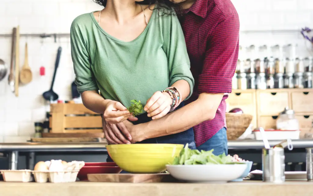 couple hugging in kitchen
